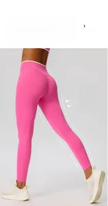 Detail of high-waist yoga pants featuring peach lift scrunch and contrast waistband