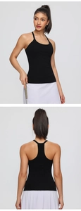 Detail view of the black racerback yoga tank top showing the built-in bra and breathable fabric