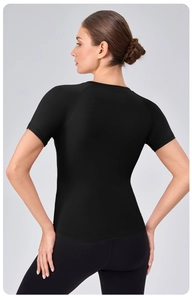 Rear view of black athletic slim-fit T-shirt showing raglan sleeves and breathable fabric