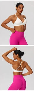 Detail of high-waist scrunch leggings with back cross sports bra in pink and white