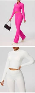 Détail de la veste de fitness zippée avec passe-pouces et coupe de sport ajustée courte
