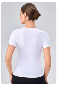 Rear view of white compression fitness top with raglan sleeves and quick-dry fabric