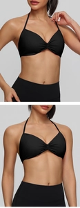 Detail of black halter sports bra featuring gathered front design and thin straps
