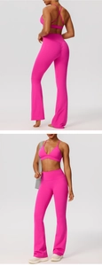 Detail view of pink flare yoga pants showing back scrunch butt lifting effect and high waist