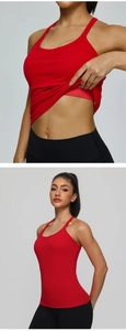Detail showing the integrated breathable chest pads inside the red sports yoga vest