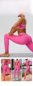 Detail of pink high-waisted leggings with white contrast piping for fitness and yoga