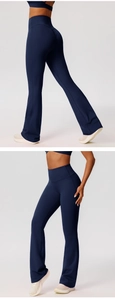 Detail of high waisted dark blue flare yoga pants with butt lift seams and elastic fabric