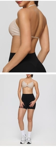 Detail view of the halter sports bra with twisted front detail and high waist shorts