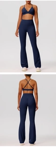 Detail view of navy blue high-waist yoga set with cross-back bra and flared sports leggings