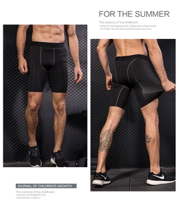 Detail of high-elasticity quick-dry men's compression shorts with ergonomic gray stitching