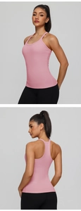 Detail view of pink yoga tank top showing breathable racerback design and slim fit cut