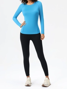 Sky blue long-sleeve sports top and black high-waist yoga pants for women gym training