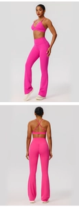 Detailed back view of rose red yoga set with criss-cross bra and flared leggings