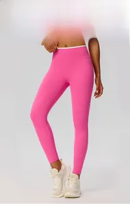 Macro shot of high-waist bright pink yoga leggings with elastic belly control band
