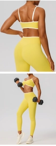 Detail showing back straps and scrunch butt design on yellow yoga set with white trim