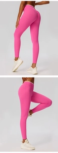 Close-up of pink high waist yoga leggings with white waist trim and scrunch butt detail