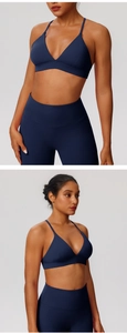 Macro detail of dark blue seamless yoga bra with V-neckline and crossed straps design