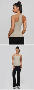Detailed racerback design on khaki yoga tank top and black flared gym leggings