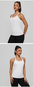 Detailed close-up showing the fit and high-elastic fabric of the white racerback yoga vest