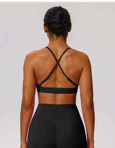 Rear view of black sports bra with criss-cross back straps and high waist yoga leggings