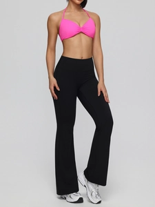 Pink halter sports bra and high-waisted black flare leggings yoga set for women