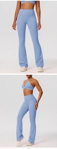 Close-up detail of light blue high waisted flared yoga pants and sports bra set