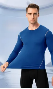 Detail of blue compression sports shirt with grey reinforced stitching and quick-dry fabric