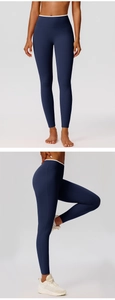 Detail of high waist yoga pants with seamless knit and white contrast piping accents