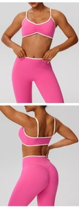Detail of pink yoga set with white contrast piping and ruched sports bra design