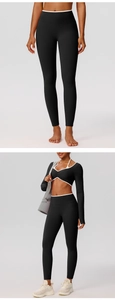 Close-up of high-waist yoga leggings and long sleeve top in black and white contrast