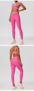 Close-up of pink sports bra with white contrast piping and ruched front detail