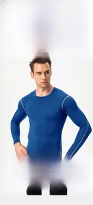 Close-up of blue compression shirt with gray ergonomic seams and muscular fit