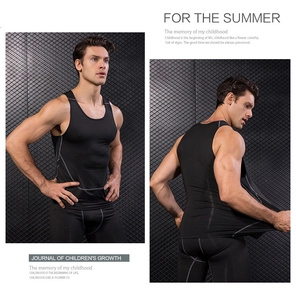 Detailed view of black compression vest with gray contrast stitching and racerback design