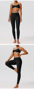 Detail of contrast binding on black yoga sports bra and high-waist fitness leggings