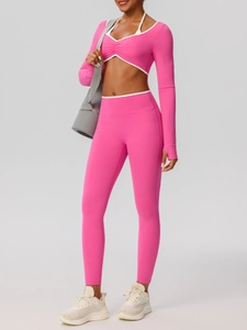 Pink high-waist yoga set with long-sleeve crop top and contrast neck leggings