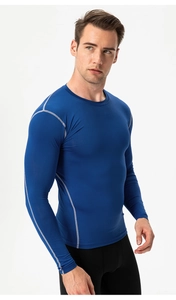 Close-up of flatlock stitching and breathable fabric on men's blue compression shirt
