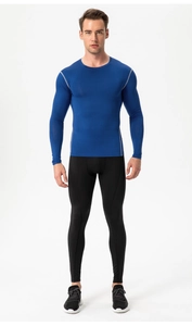Detail view of royal blue compression shirt stitching and high-elastic quick-dry fabric