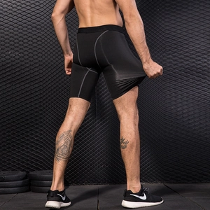 Men's compression sports shorts in black quick-dry fabric showing high elasticity stretch