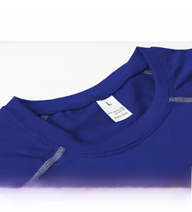 Detail of blue compression shirt neckline with 85% polyester fabric and size label