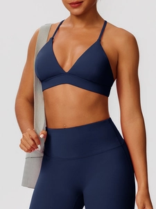 Dark blue yoga set with V-neck sports bra and high-waisted leggings in matte fabric