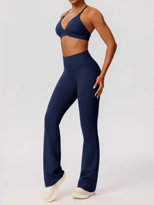 Dark blue high-waisted flared yoga pants and slim strap sports bra set for fitness