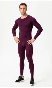 Detail of dark purple compression suit with high-stretch fabric and flatlock stitching