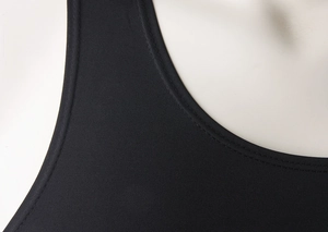 Macro detail of high-elastic sports vest featuring precision flat-lock stitching on collar