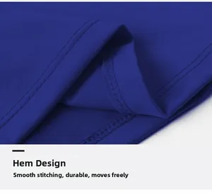 Macro detail of royal blue compression shirt hem showing double-needle flatlock stitching