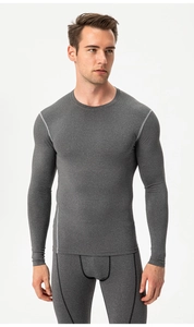 Detailed close-up of dark heather gray compression set with ergonomic seams and high elasticity