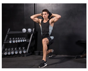 Detail of moisture-wicking compression tank top and shorts set on athlete in gym