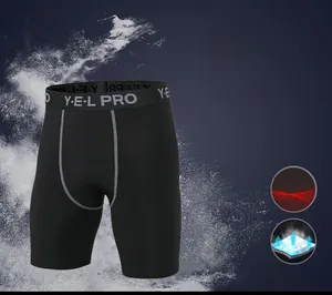 Detail of black compression shorts with Y-E-L PRO logo waistband and reinforced stitching