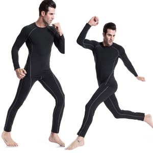 Detail of men's athletic compression set with gray flatlock stitching for muscle definition