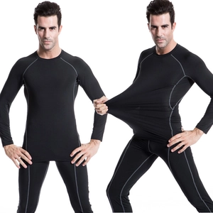 Detail showing the high-stretch elastic fabric of the men's athletic compression sports suit