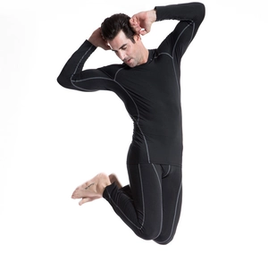 Detail view of men's compression shirt with durable reinforced gray stitching and high elasticity